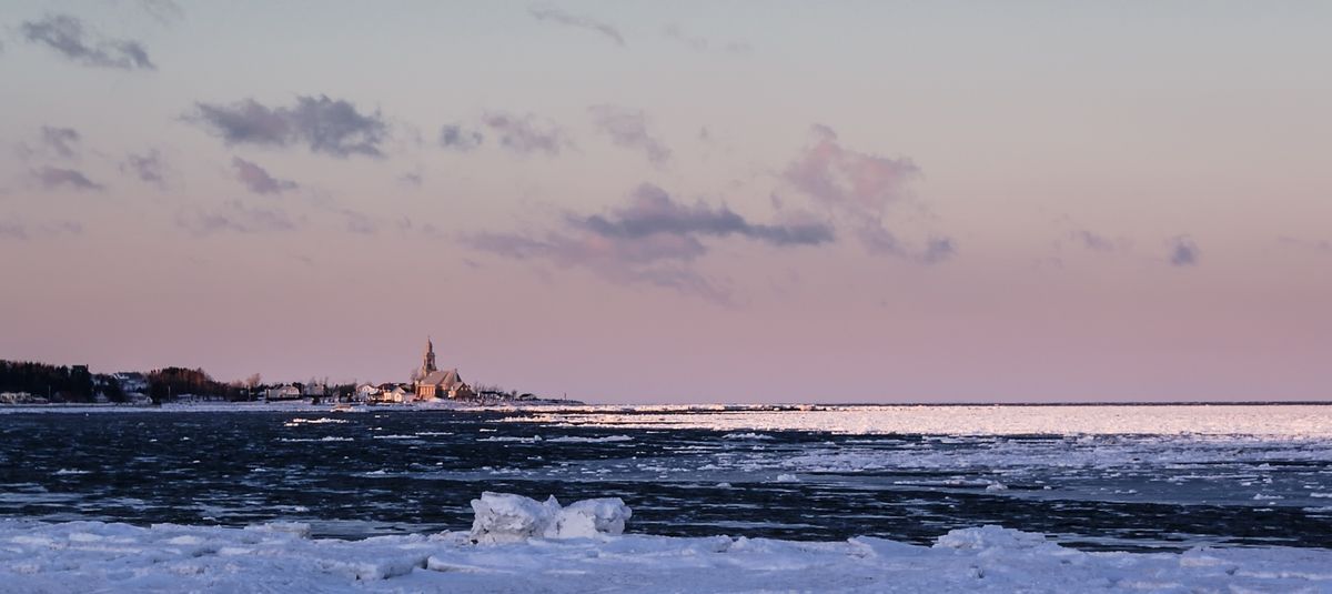 A Church in the border of the St-Lawrence River in Ste-Luce Sur mer, Quebec Canada. -25° Celsius in the Morning