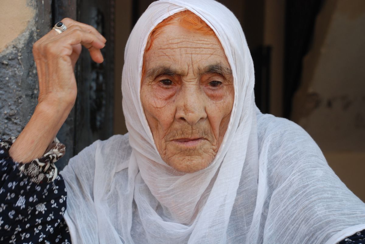 A blind grandmother in the streets of Turkish Adana